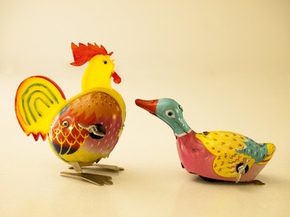 Duck and chicken tin toy / Isolated white