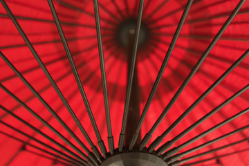 Red Umbrella With Black Metal Poles Outside