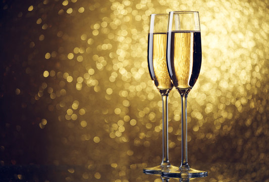 New Year picture of two wine glasses with wine on yellow background