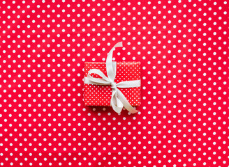 Celebration,party backgrounds concepts ideas with gift box present in red dot pattern  color on cloth table
