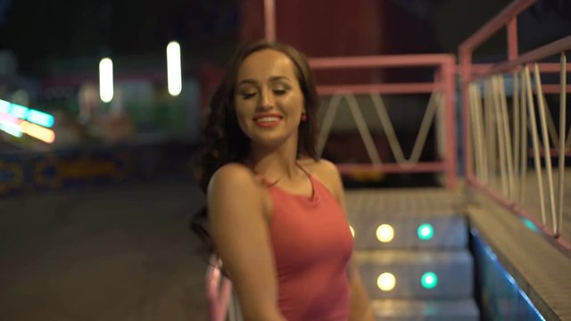 Sexy rich girl's dancing in furry coat at night street 4K