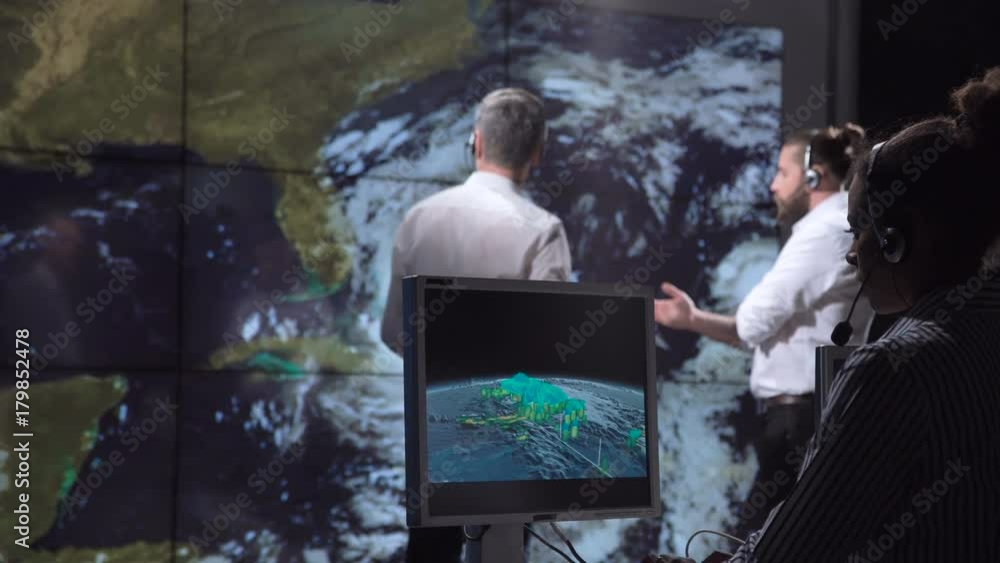 Wall mural group of scientists investigating hurricane as consequence of global warming on earth. elements of t