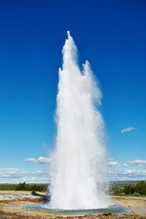 Summer in Iceland. Eruption of Strokkur Geyser in Iceland. Magnificent geyser Strokkur. Fountain Geyser throws azure water every few minutes