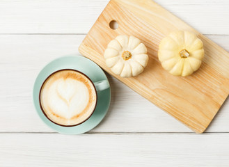 Fototapeta na wymiar Pumpkin spice latte. Coffee top view on white wood background