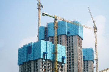 Fototapeta na wymiar building construction site with construction frame and crane