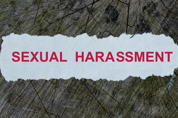 Sexual harasment word on a cut out newspaper