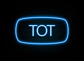 Tot  - colorful Neon Sign on brickwall