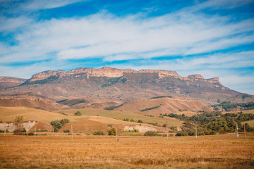 Fototapeta na wymiar Landscape with canyon, blue sky and field