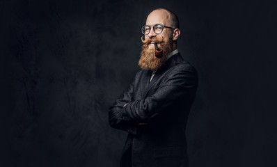 Redhead bearded male in a suit.