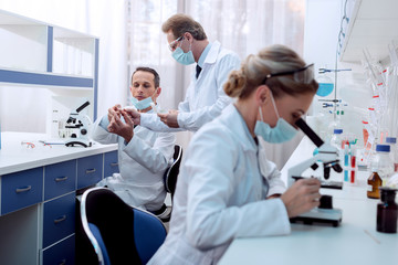 Chemist doing microscope analysis