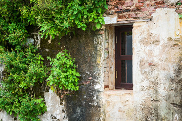 Fototapeta na wymiar Old house with a wooden window.