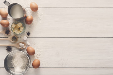 Baking ingredients on rustic white background
