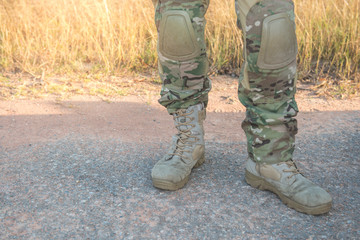 The soldiers stood waiting for the supervisor on the road to prepare out to battle