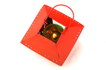 Decorative lantern with burning candle 