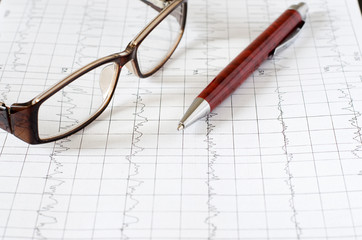 Electrocardiogram graph (ECG), heart analysis. Ballpoint pen