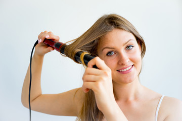 Girl taking care of her hair