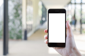 Close up of a man using smartphone with blank screen mobile.