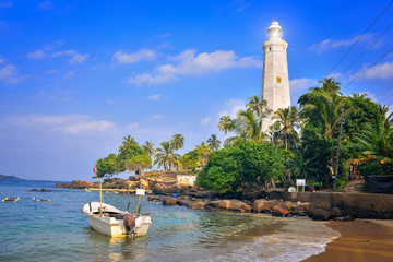 Southernmost Point in Sri Lanka, the white lighthouse on the shores of the Indian Ocean