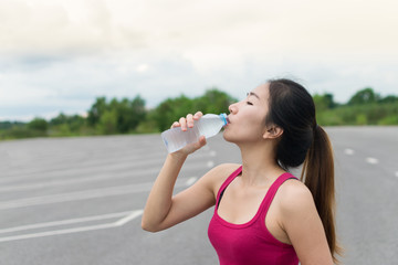 Asian girl drinking water