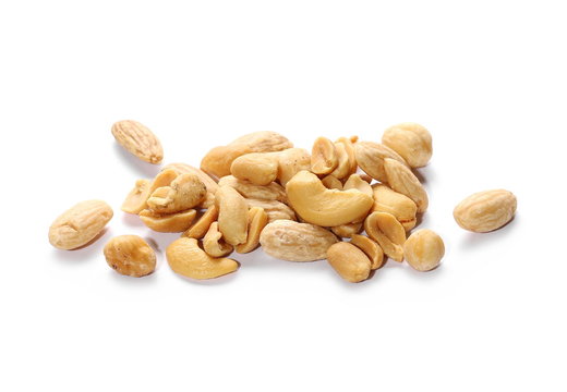 Mix of roasted and salted peanuts, cashew nuts, almonds and walnuts isolated on white background
