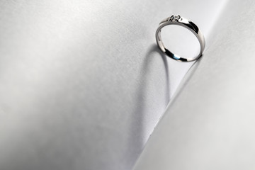 Close up of Platinum wedding Standing middel of two white paper and shadow look like a heart