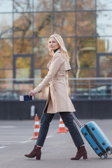 Obraz premium woman with suitcase and flight ticket