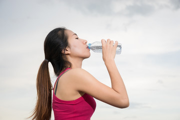Asian woman drinking water