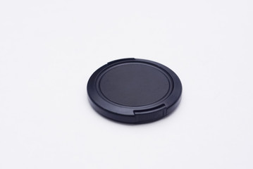 Camera Lens Cap Over White Background