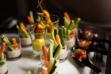 Verrines appetizer with salmon pate red caviar cucumber cream cheese herbs capers in glasses