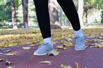 Recreation in the park during fall season - jogging and walking