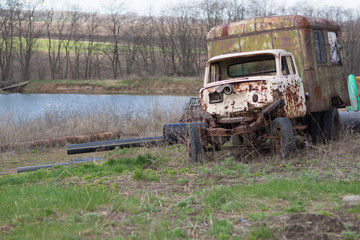 Battered old truck parked in the grass