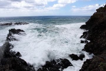 waves crashing on the rocky coast e