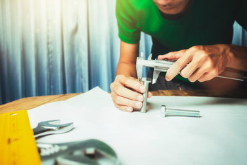 Fototapeta premium Working hard of businessman factory engineer in office main worktable mechanical zone.