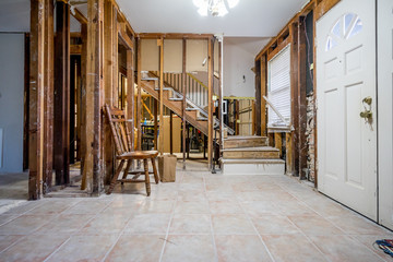 Bare walls of a flooded home after drywall and floors have been removed