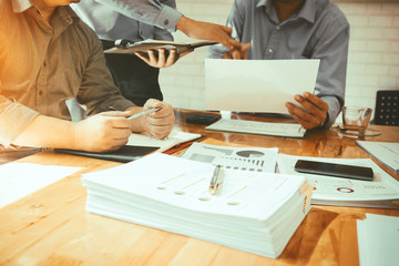 Business colleagues are meeting to determine their duties to summarize annual performance in the...