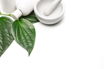 Cosmetic bottles, betel leaves, crushed.