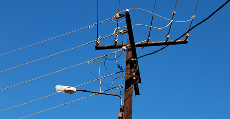 power line with electrical pole in the clear sky
