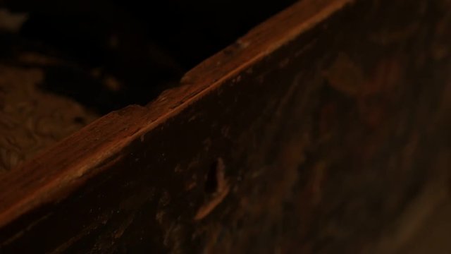 Slow motion of old wooden chest opening footage - Hand opens weathered dusty furniture inside abandoned house slow-mo