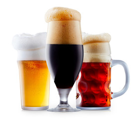 Mug collection of frosty dark red and light beer with foam isolated on a white background