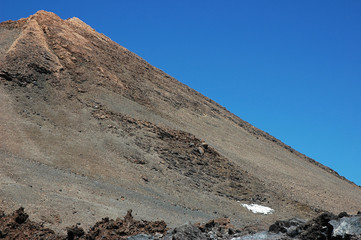 Cropped shot of the summit of Pico del Teide, the highest volcanic peak in Spain, under a bright...