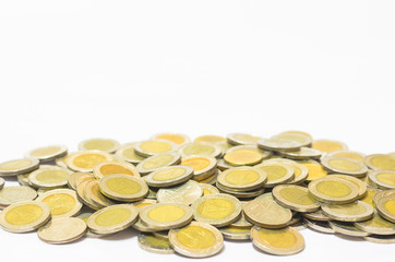 many coins currency Thai Baht lay down on white background. financial and saving concept.
