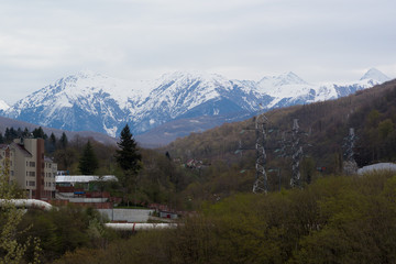 Fototapeta na wymiar The city on the background of snowy mountains