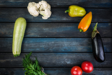 Ingredients for grilled vegetables salad with zucchini, eggplant, onions, peppers and tomato. Top view