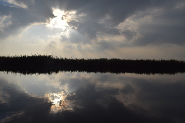 Autumn sun lake reflection landscape in the netherlands