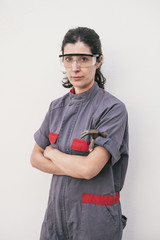 Posing worker woman with uniforms and working clotes