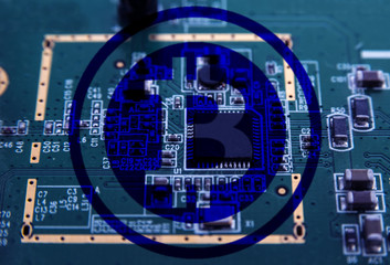 Bitcoin symbol Cryptocurrency on computer circuit board. Macro shot.