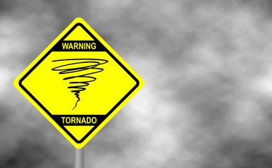 Warning tornado sign road. Yellow hazard warning sign against grey sky - tornado warning, bad weather warning, vector illustration. Hurricane season with symbol sign against a stormy background.