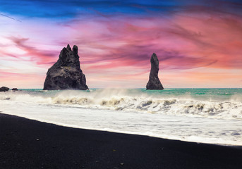 Unbelievable seascape of Reynisdrangar cliffs in the Atlantic ocean.