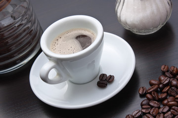 pile of coffee beans and a cup