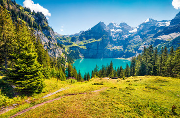 Colorful summer morning on the unique Oeschinensee Lake